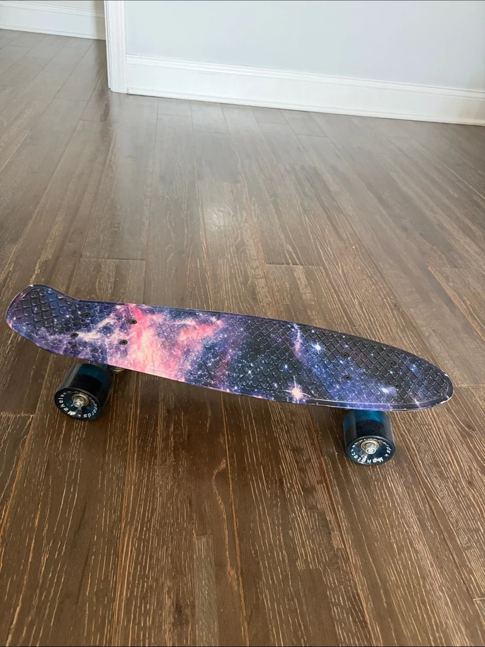 Galaxy Print Skateboard Wall Accent in Purple and Pink